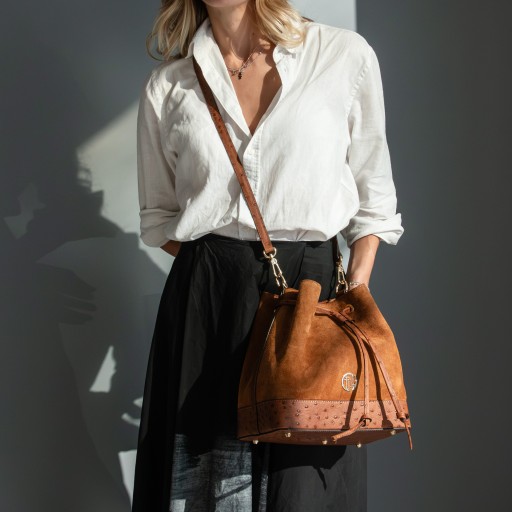 Ostrea Suede and ostrich effect printed leather bucket bag